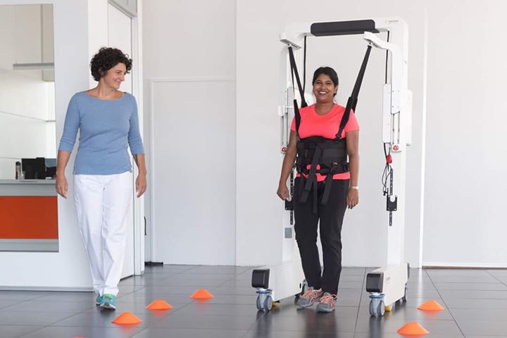 Are you wondering how Robotic devices can help patients in these challenging times of COVID-19?
A recent report from Changi General Hospital (CGH), shows how the Robotics Ambulation Device helped their patient to retrain walking after a severe pneumonia. 
Read more....
Changi General Hospital, Singapore recently published a very interesting case description of a lady using the Robotics Device to retrain walking after a Pneumonia. Especially in times of COVID-19, we think this article can be really helpful for all clinicians out there.
The case described involves a 31-year-old patient with an arthrogryposis multiplex congenita, a rare, non-progressive congenital disease leading to multiple joint contractures and muscle weakness. For this particular patient, the disease led to scoliosis and an associated Restrictive Lung Disease. Due to this pre-condition, when she was recently hospitalized with pneumonia, she needed ventilator support and ICU care. Following release to the general ward, the patient was unable to ambulate further than 3m, even with physical support and she had a dependency on oxygen.
And here is where the Robotics Device came in. Referred to an inpatient rehabilitation program, the Robotics Device permitted the patient to start walking training despite her conditions and by the 6th session, she was able to walk over 300m with only minimal body weight support. This improvement also transferred to her everyday life, as she is able to walk 80m with a walking stick and no longer depends on additional oxygen supply.
In this case, the Robotics Device provided exactly the safe and permissive environment that was needed to allow overground gait training. It provided just enough support to permit the training, but only as much as needed, so that gains in walking ability transferred to walking outside of the device.
The authors of the case report conclude that gait training performed with the Robotics Device facilitates pulmonary rehabilitation and recommended this knowledge can be generalized to other patients with similar conditions.

#COVID_19 #MissionHealth #PulmonaryRehab #Ambulation #Robotics #MovementIsLife